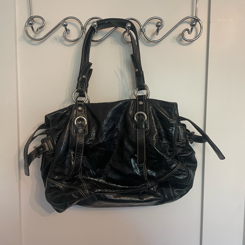 Francesco Biasia black leather shoulder bag w/ white stitching & silver accents.
